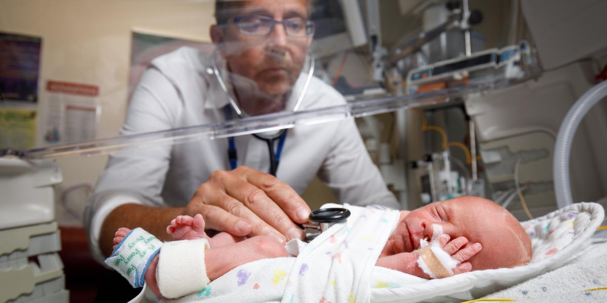 A medical staff checking a newborn baby