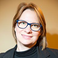 Headshot of Isa Bartkowiak Theron.